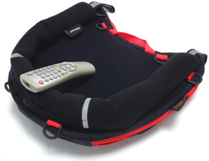 Image shows a Trabasack Curve Connect on a flat, plain surface with a remote control on the tray side