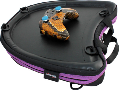 Image shows the purple-trim Trabasack Curve with a yellow patterned X-Box controller on the tray surface